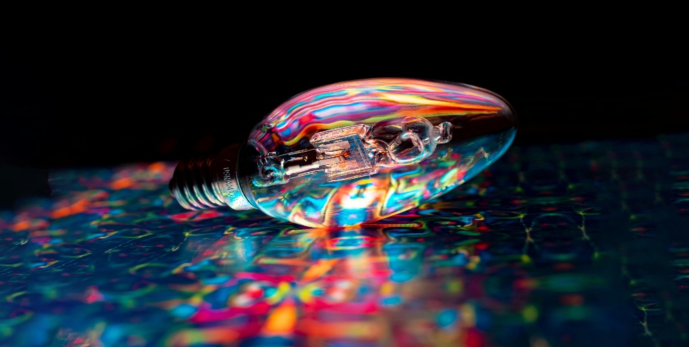 lightbulb on colourful surface