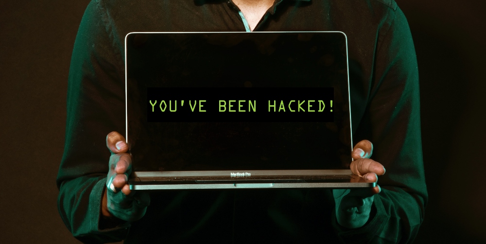 you've been hacked letters on laptop