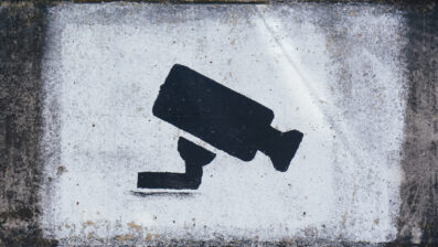 Graffiti of a security camera sprayed on a wall